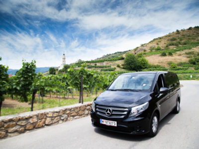 Drive with luxury van through vineyards at Wachau Valley