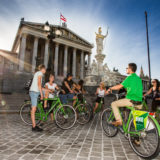 Guide showing group the Paliament in Vienna