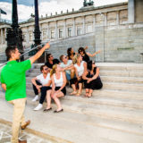 Guide showing a group Vienna Parliament